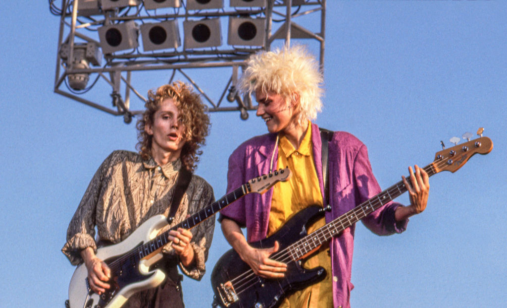 The look of the musicians of New Wave & Pop Robert Holmes, in electric guitar, and Aimee Mann, in Bas guitar, both band 'Til Tuesday, perform on stage at Liberty State Park, Jersey Jersey, July 4, 1985.